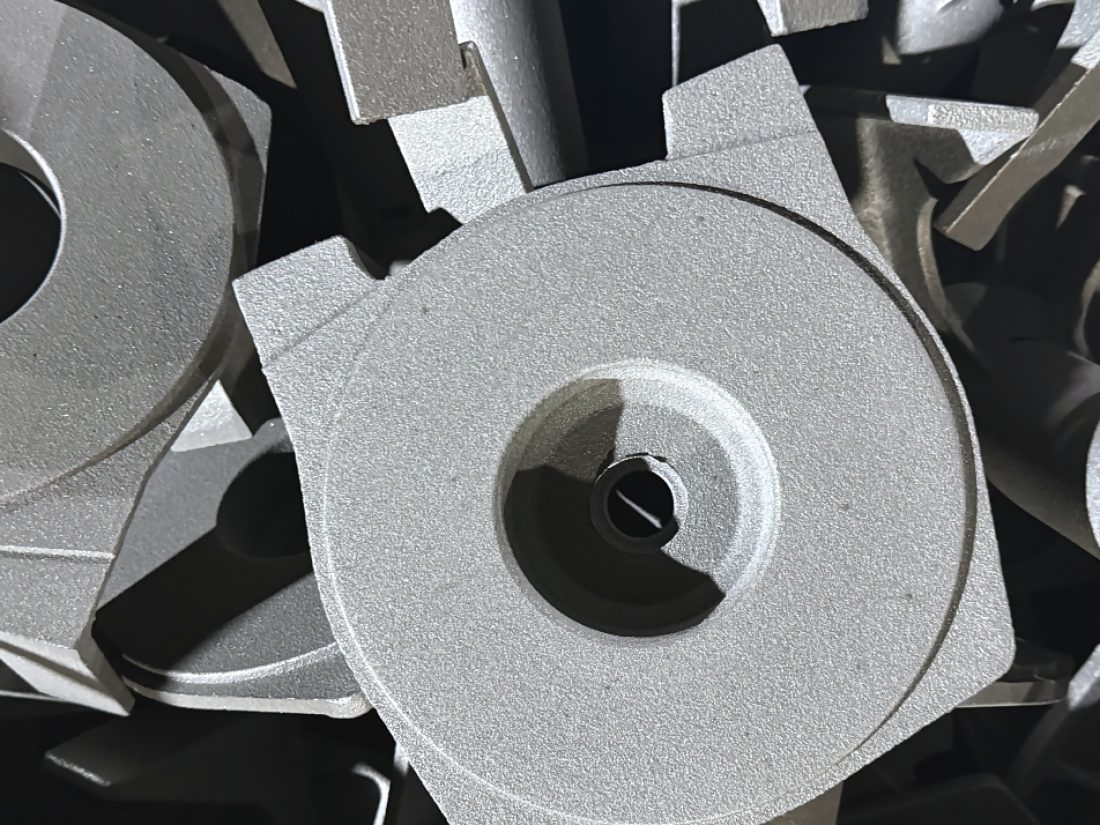 Freshly cast impellers stacked after shot blasting