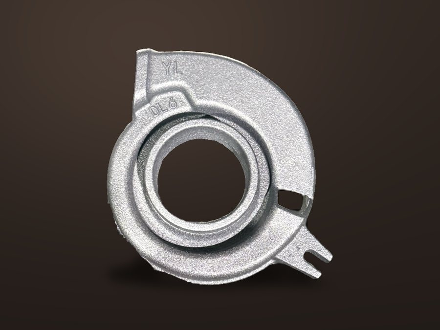 Spiral volute pump casing on a dark studio background