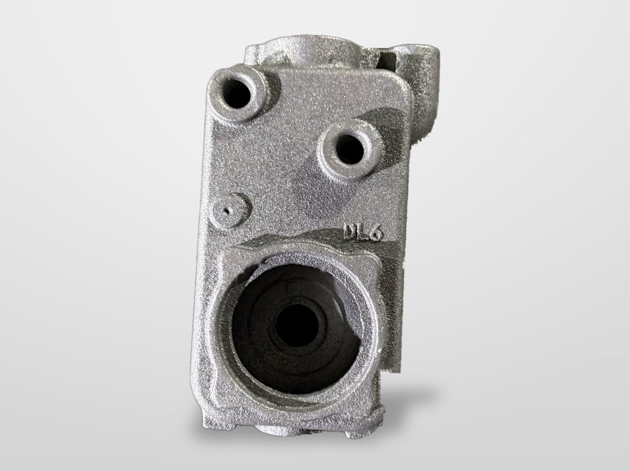Close view of a square sand-cast pump casing