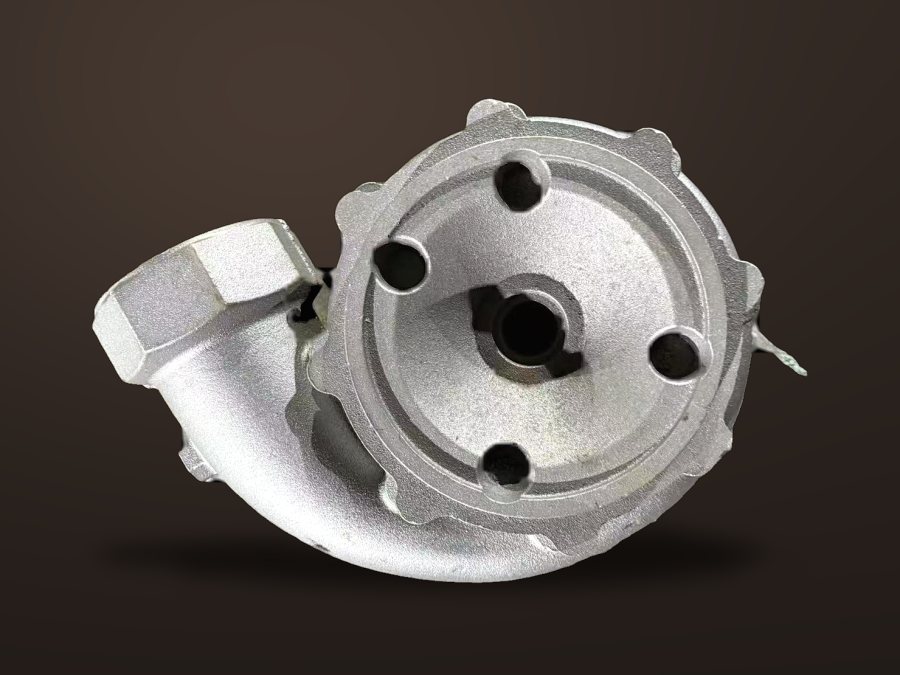 Cast pump cover with machined register, dark studio background